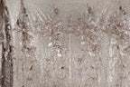 a close-up view of a fabric with a floral pattern, including various shades of brown and beige. The fabric appears to be made of sequin material, giving it a shiny and decorative appearance.