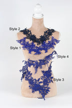 A mannequin wearing a blue lace dress with three distinct styles: Style 2, Style 1, and Style 4.