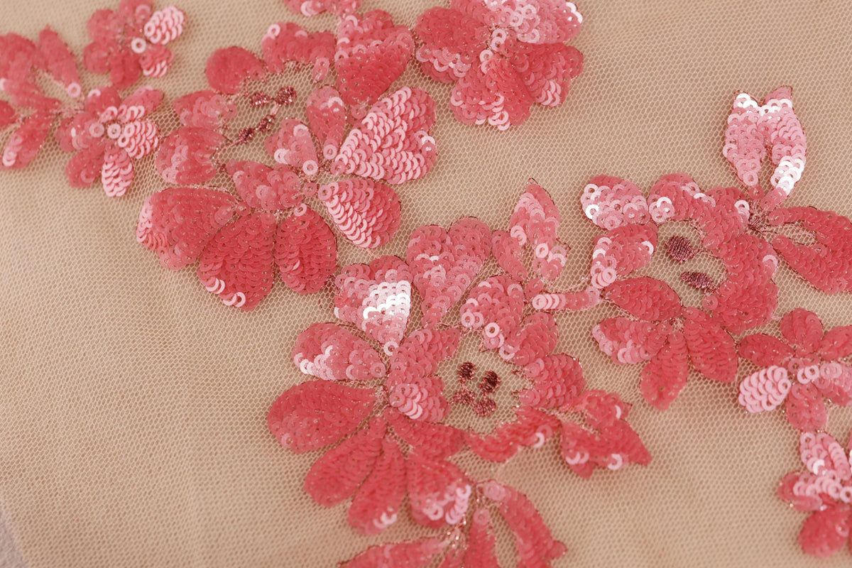 a close up of a piece of cloth with flowers on it
