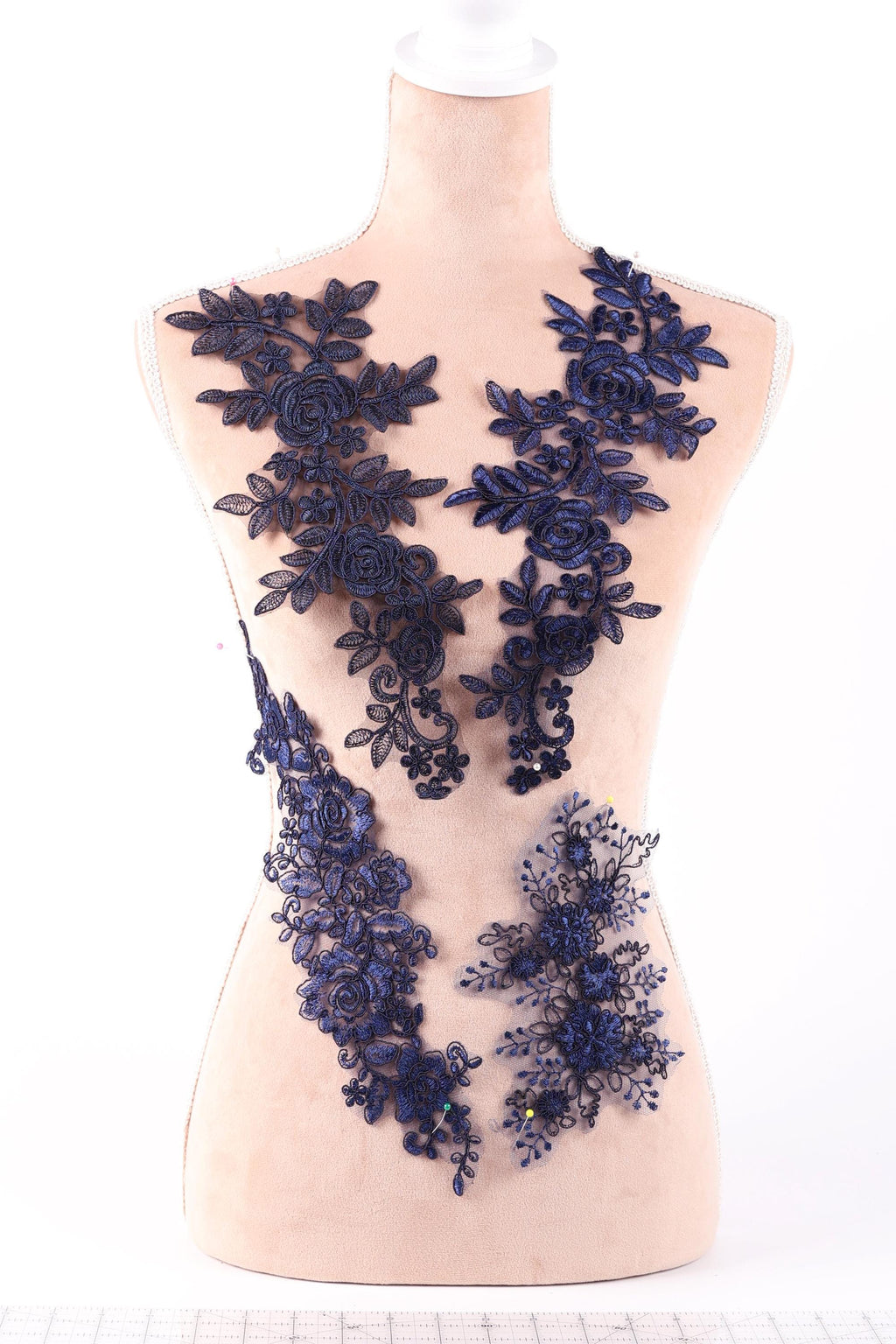 A mannequin wearing a dress with a floral pattern in shades of blue.