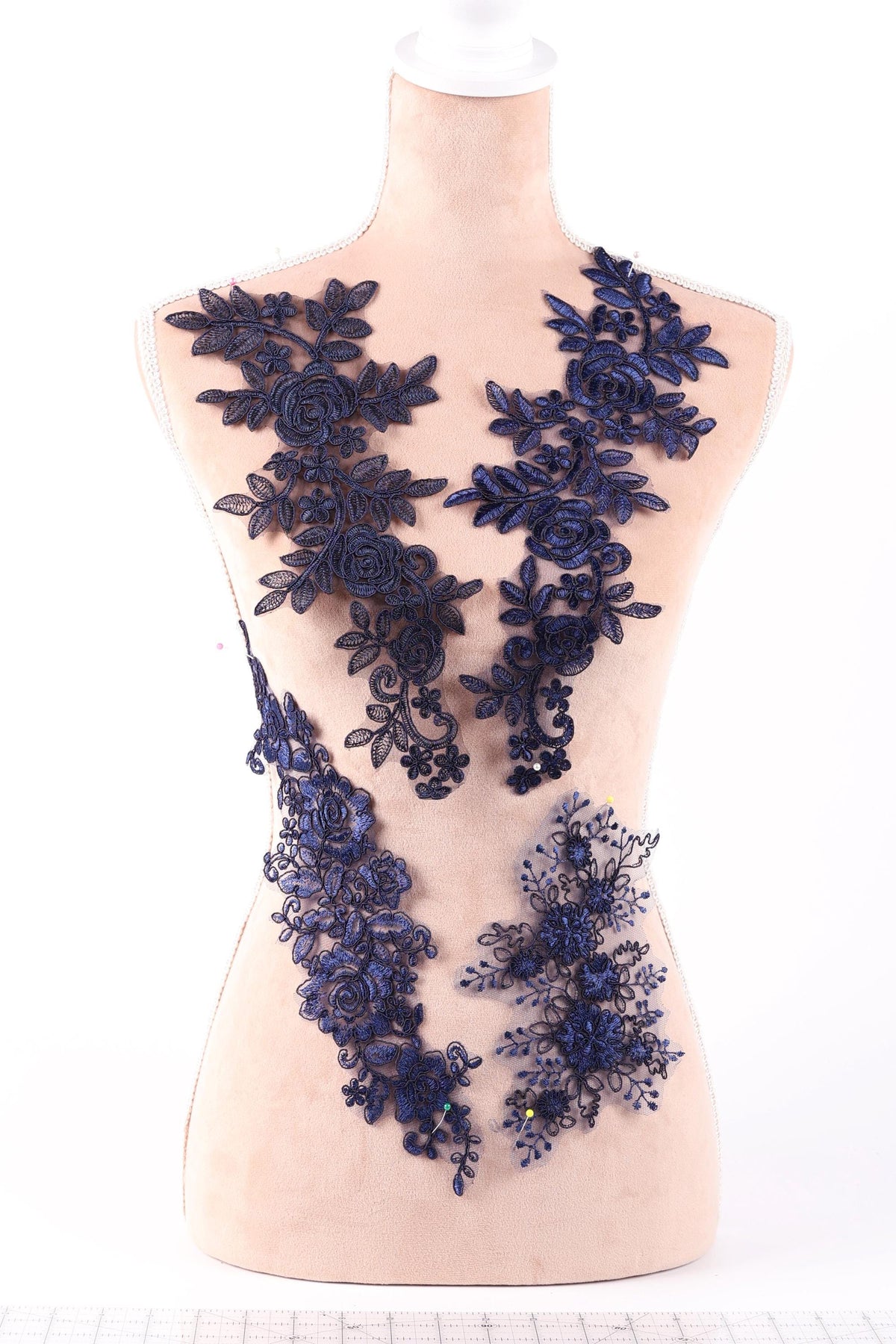 A mannequin wearing a dress with a floral pattern in shades of blue.