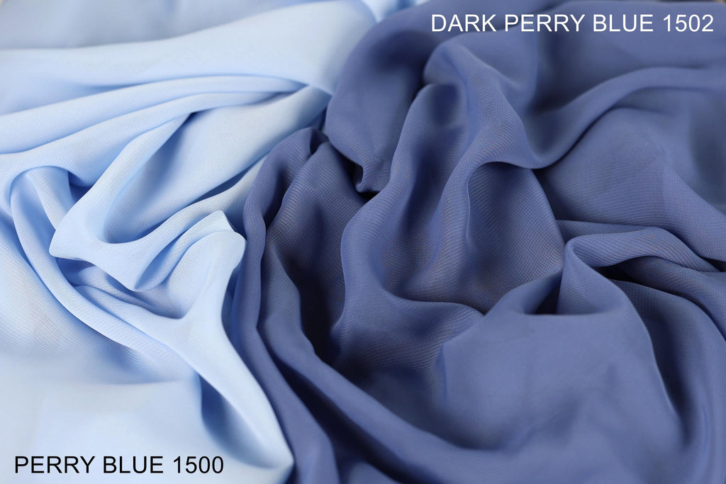 two different shades of blue fabric, one being a darker shade of blue and the other being a lighter shade of blue. The text "DARK PERRY BLUE 1500" is visible, indicating the color of the fabric.