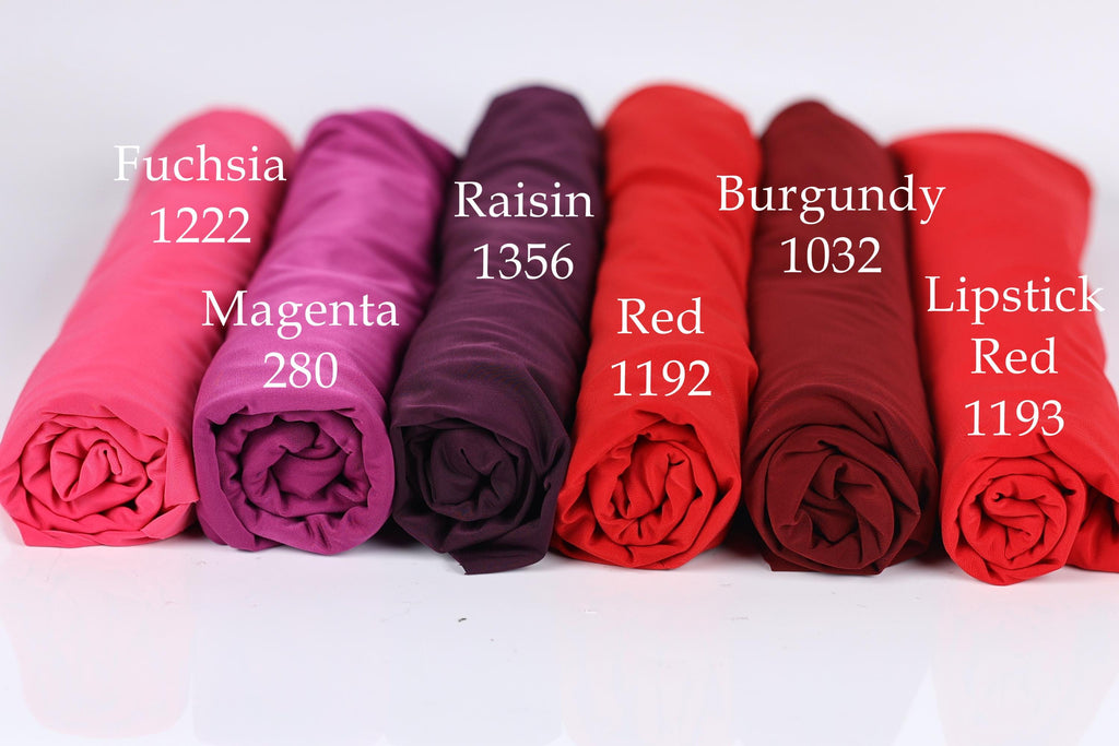six rolled-up fabric swatches in various colors, including Fuchsia, Raisin, Burgundy, Magenta, Red, and Lipstick Red.