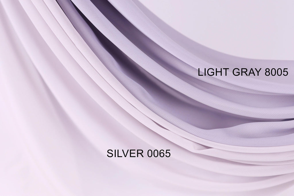 a close-up view of a fabric with a gradient of light and dark purple colors. The fabric appears to be made of a soft, flowing material, possibly silk or chiffon. The image is labeled with the text "LIGHT GRAY 8005" and "SILVER 0065" to identify the specific fabric color and material.