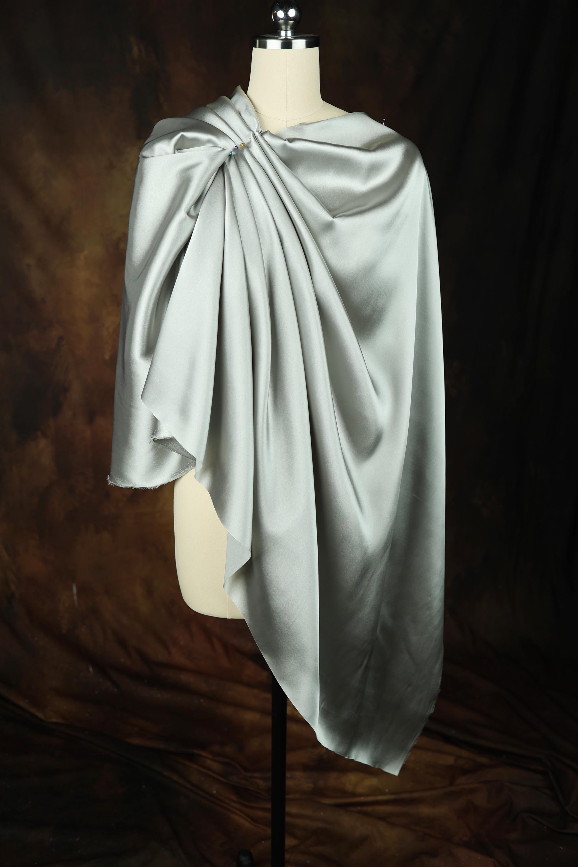 a mannequin is covered with a white cloth