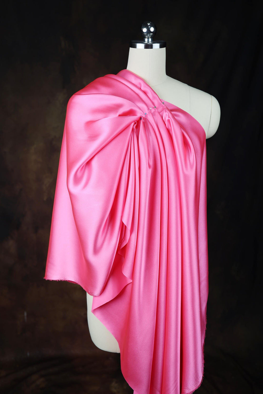 a mannequin with a pink dress on it