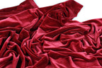 a close-up view of a crumpled, red velvet fabric.