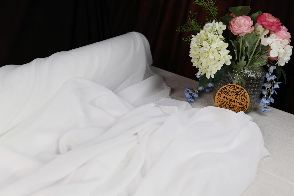 a vase of flowers sitting on top of a table