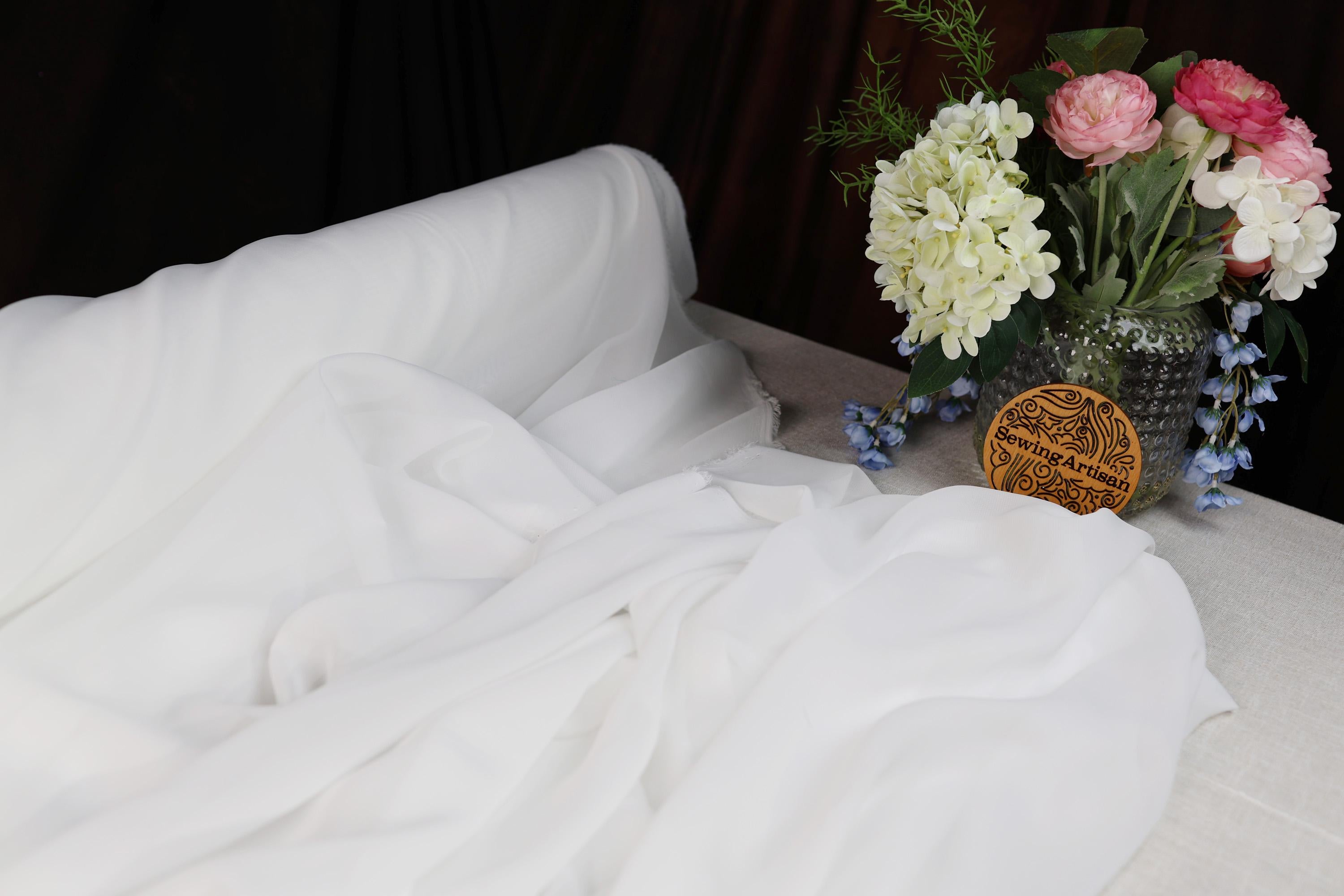 a vase of flowers sitting on top of a table