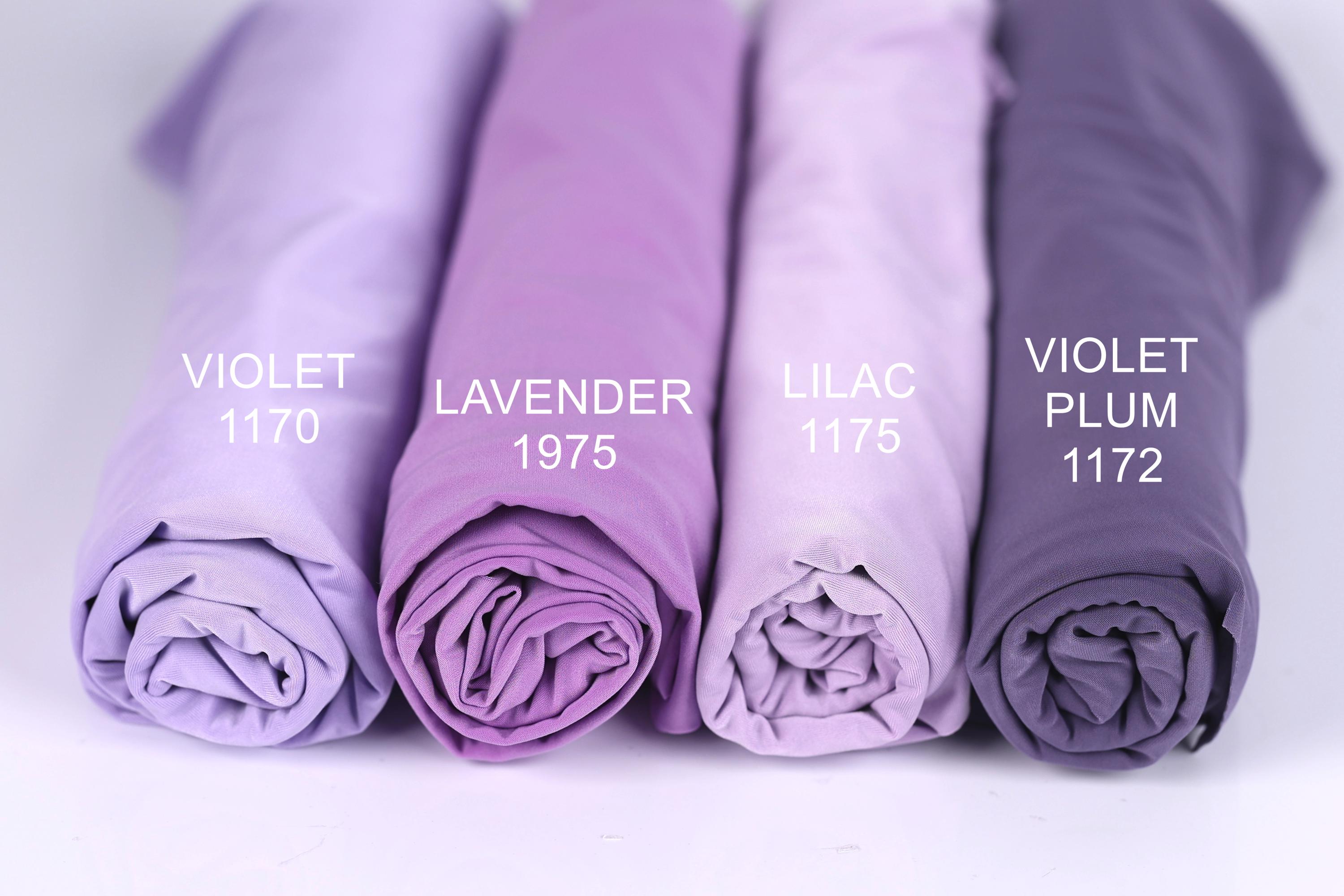 Four rolled-up fabric swatches in different shades of purple, labeled with the names of the colors: violet, lavender, lilac, and plum.