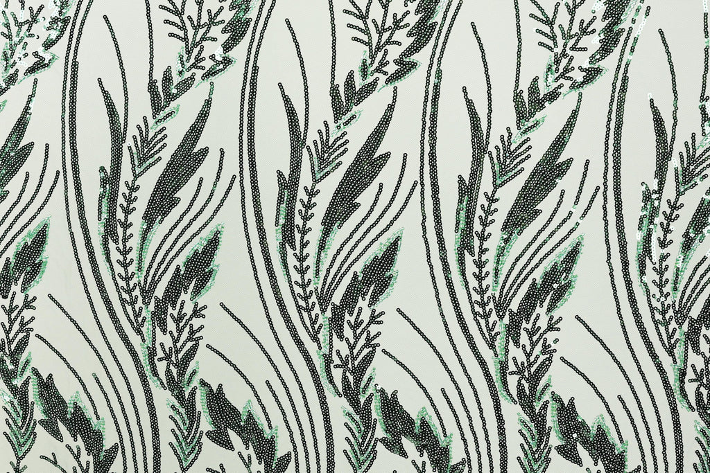 a repeating pattern of stylized green and black lines and shapes, creating a visually striking and intricate design.