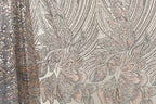 a close-up view of a fabric with a floral pattern, showcasing intricate details and textures.