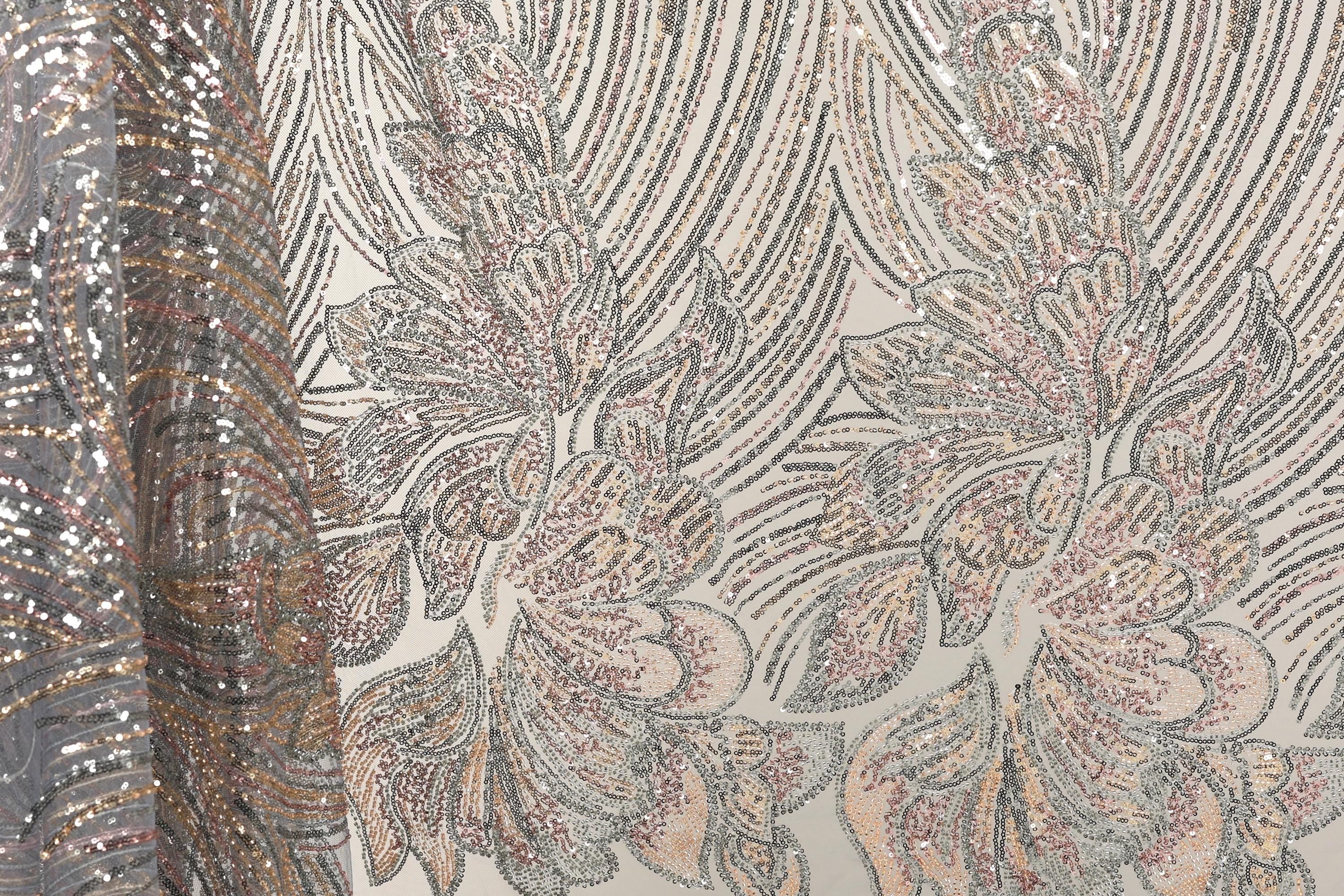 a close-up view of a fabric with a floral pattern, showcasing intricate details and textures.