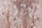 The image is a close-up of a delicate, pink sequined dress with intricate floral embroidery.