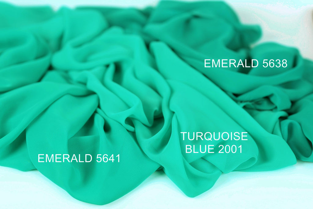 a close-up of a crumpled piece of turquoise fabric, with text indicating the color and brand of the fabric.