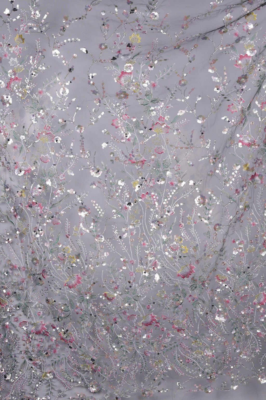 The image is a collage of various images, each featuring a different floral pattern. The patterns are predominantly white and gray, with some accents of pink and green. The overall composition creates a visually appealing and intricate design.