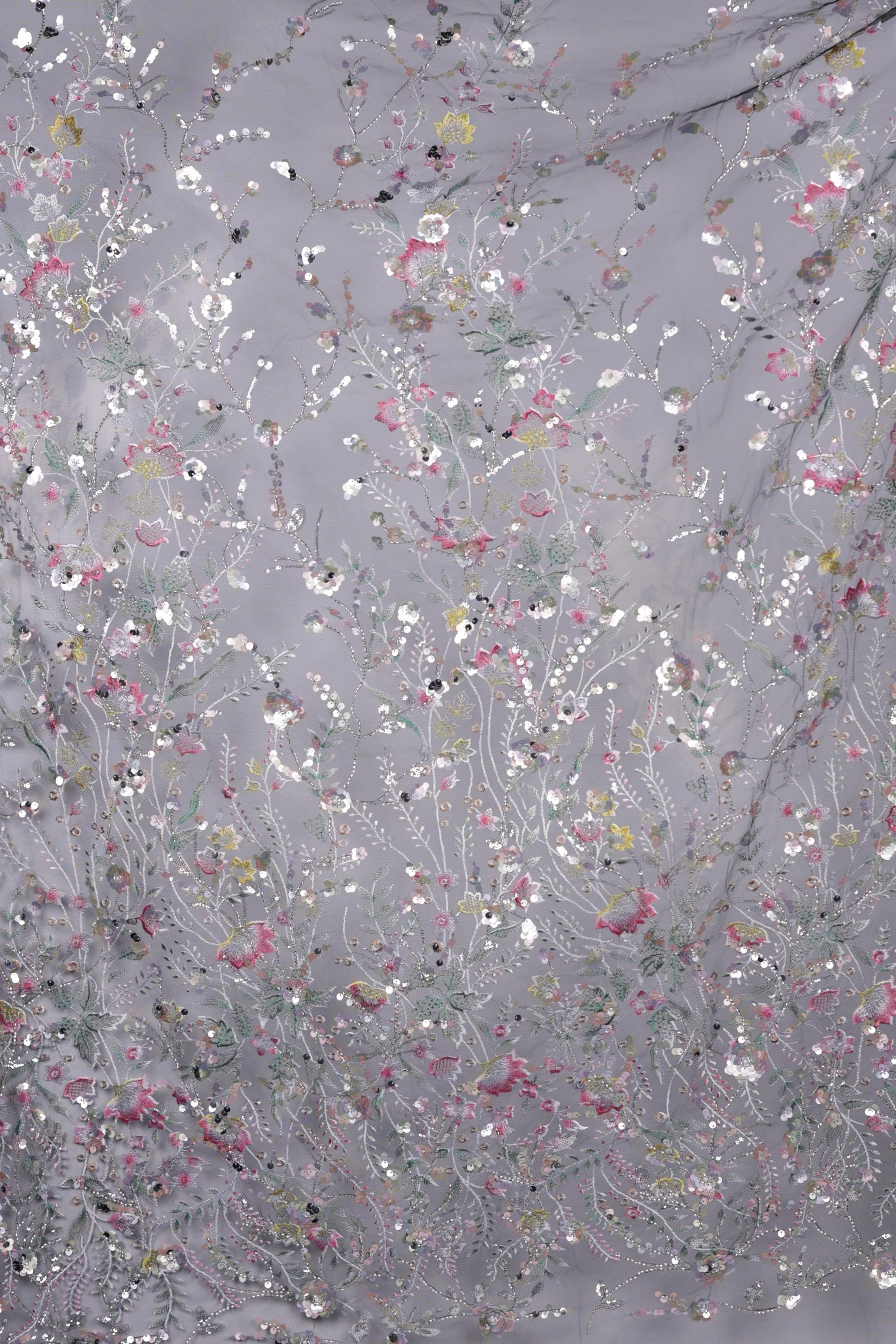 The image is a collage of various images, each featuring a different floral pattern. The patterns are predominantly white and gray, with some accents of pink and green. The overall composition creates a visually appealing and intricate design.