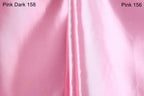 a close-up of a pink satin fabric, with a focus on the color and texture. The text "Pink Dark 158" and "Pink 156" are visible, indicating the color of the fabric.