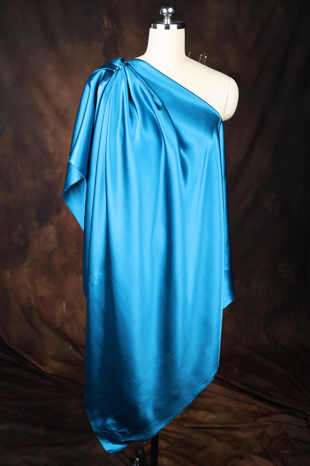 a dress on a mannequin with a dark background