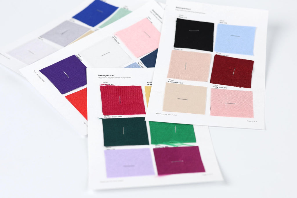 a collection of fabric swatches, each with a different color, arranged on a white background.