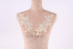 A mannequin with a delicate, lace-like design on its chest area.