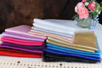 a stack of cloths sitting on top of a table