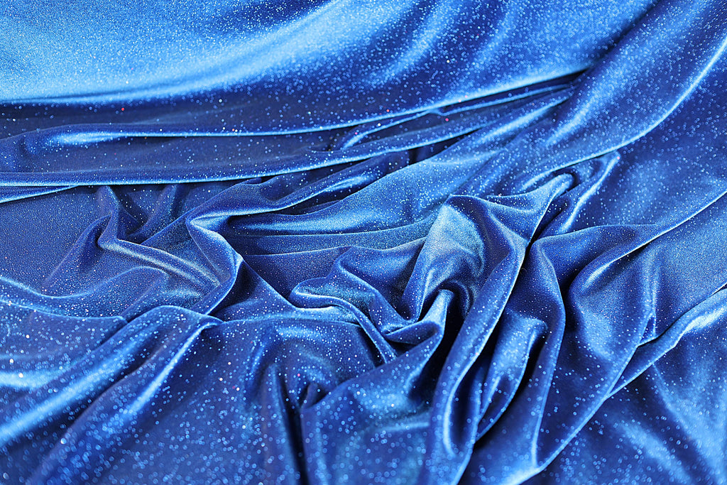 a close up of a shiny blue fabric