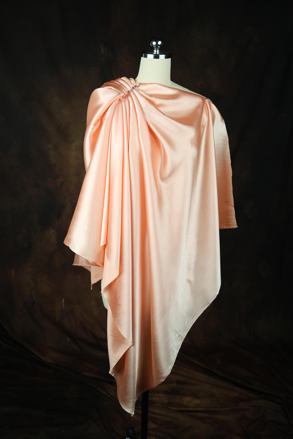 a dress on a mannequin on a black background