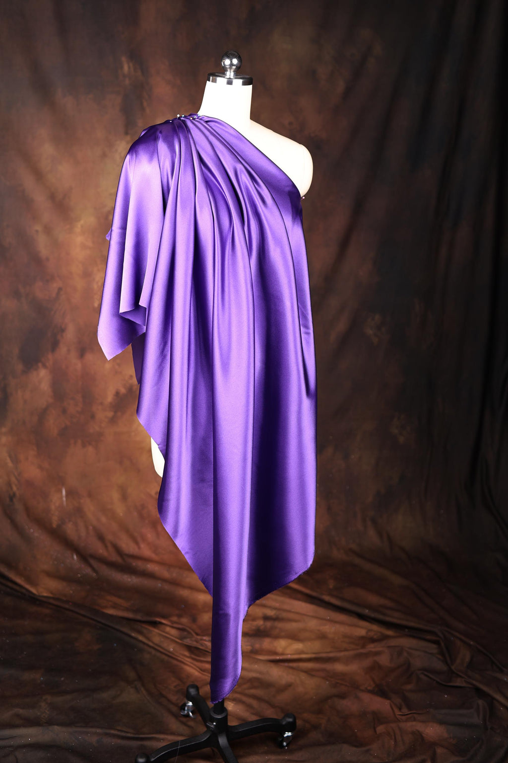 a dress on a mannequin on a brown background