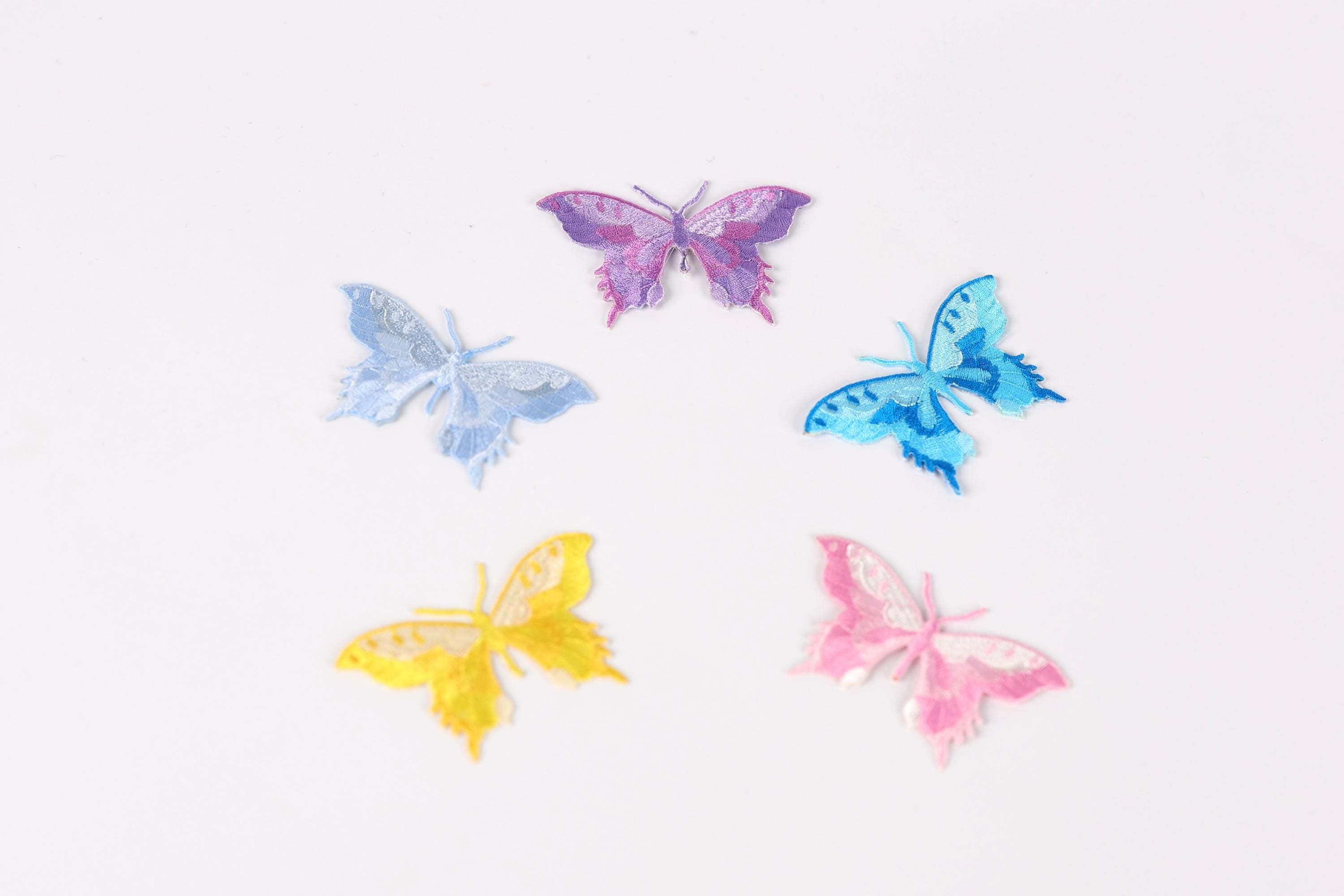 five colorful butterfly stickers arranged in a circular pattern against a white background.