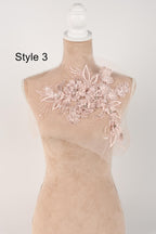 A mannequin with a decorative floral lace piece on its bust, displayed against a plain background.