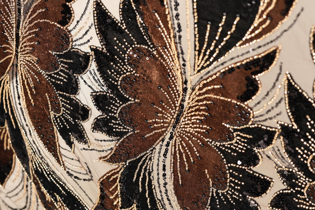 a close-up view of a fabric with a floral pattern, showcasing intricate details and textures.