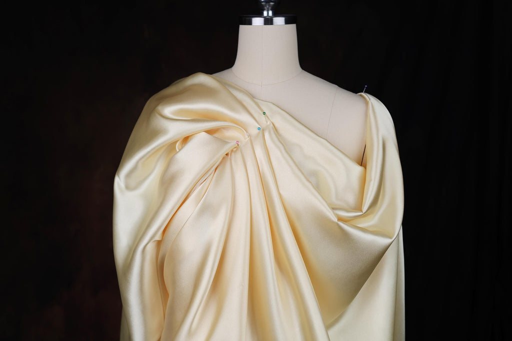 a mannequin with a dress draped over it