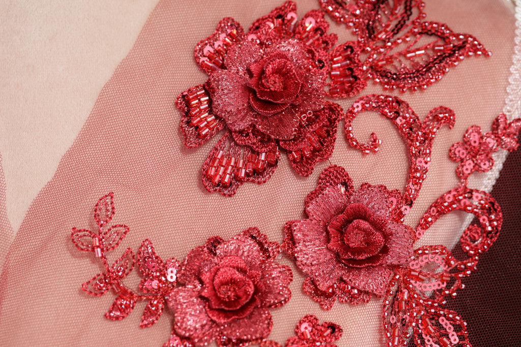 a close up of a dress with flowers on it