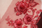 a close up of a dress with flowers on it