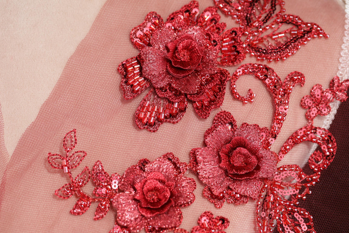 a close up of a dress with flowers on it