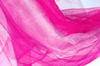 The image is a close-up of a fabric with a pink and white color scheme, featuring a shiny, sparkly texture.