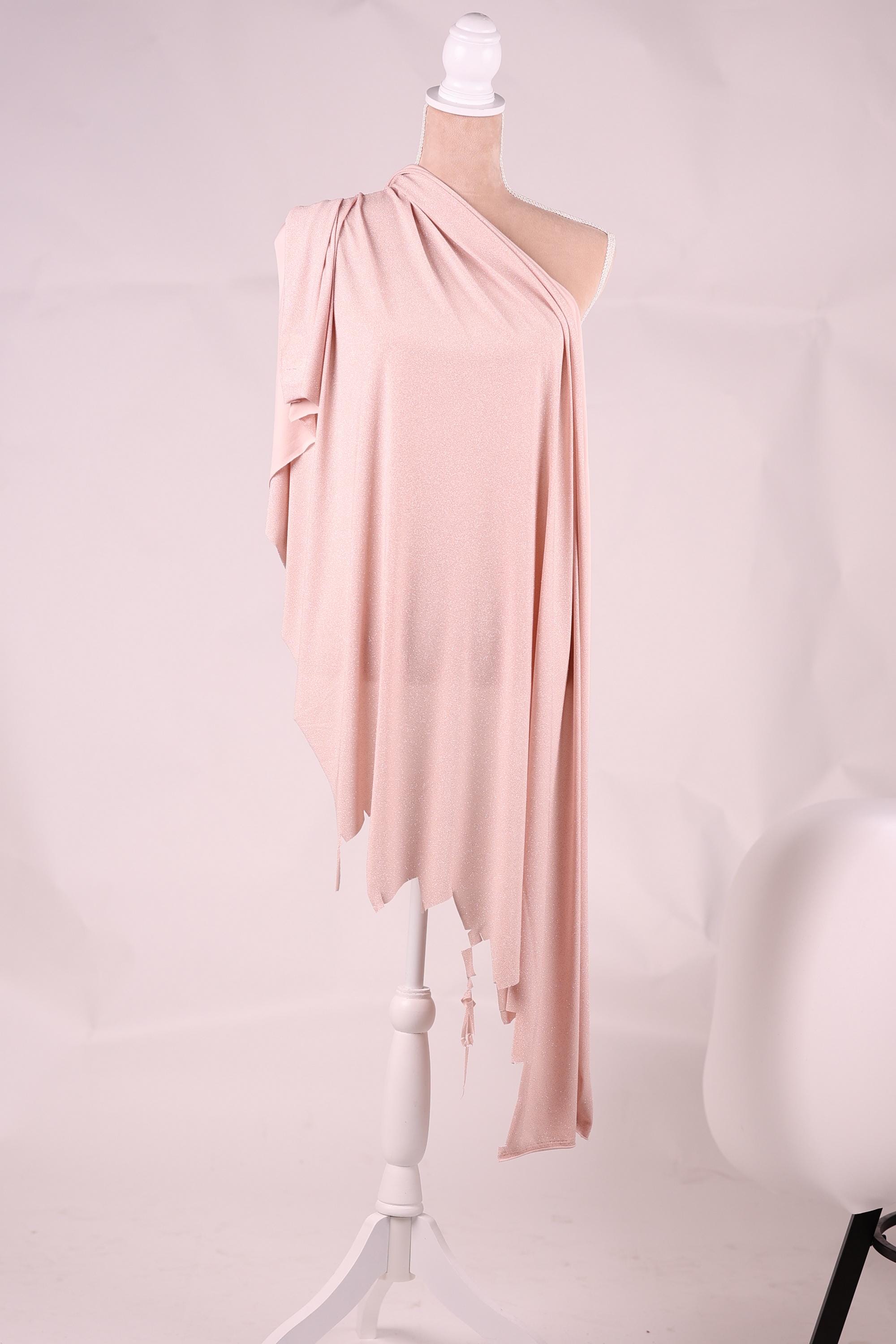 A mannequin wearing a pink one-shoulder dress with a draped, flowing fabric draped over the shoulder.