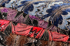 a close-up view of a fabric with a floral pattern, showcasing the intricate details and textures of the material.