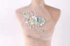 A mannequin with a delicate floral embroidered on its bust.