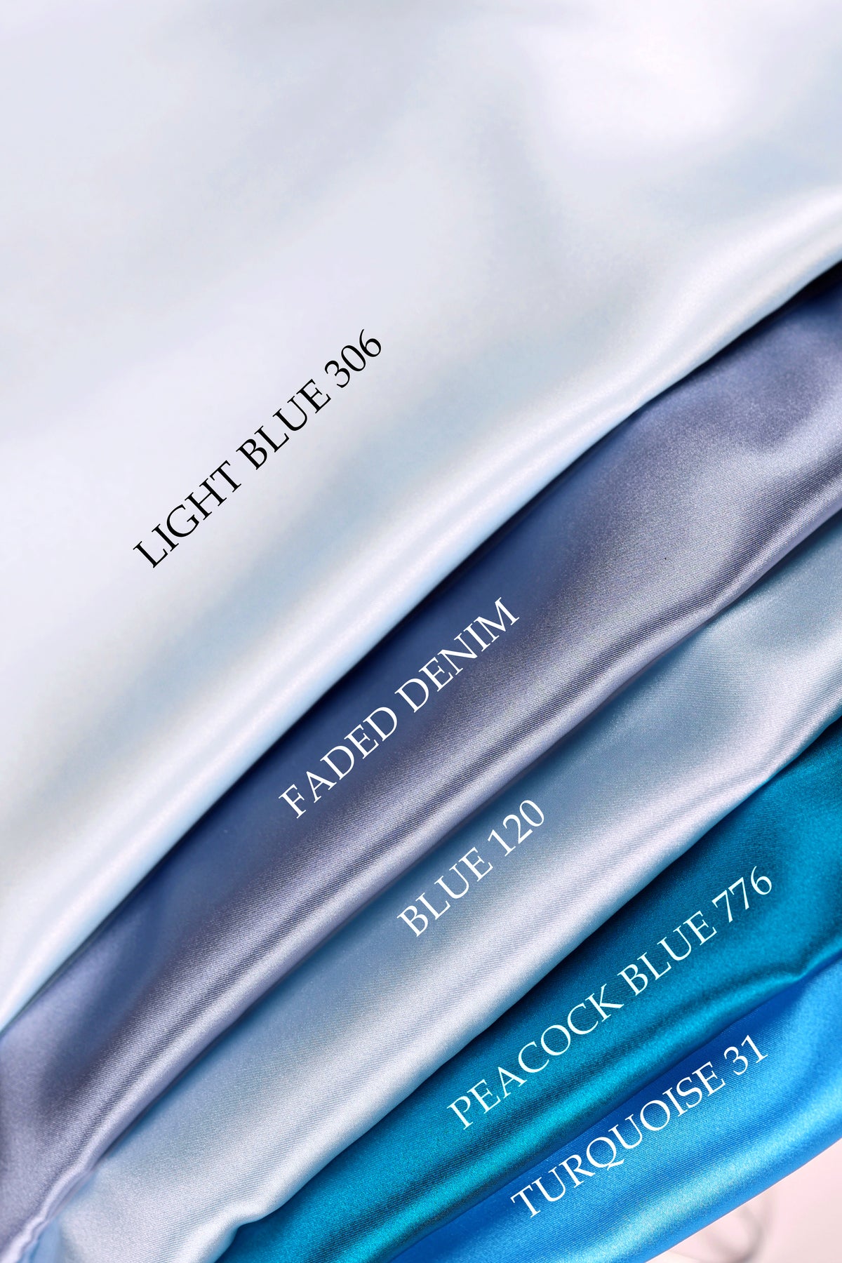 a collection of four different colored satin fabrics, each labeled with a color name.