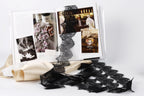 The image is a collage of various photographs, including one with lace, another with flowers, and a third with a person. The collage is spread across a white surface, with a black lace ribbon and a pair of scissors visible among the images.