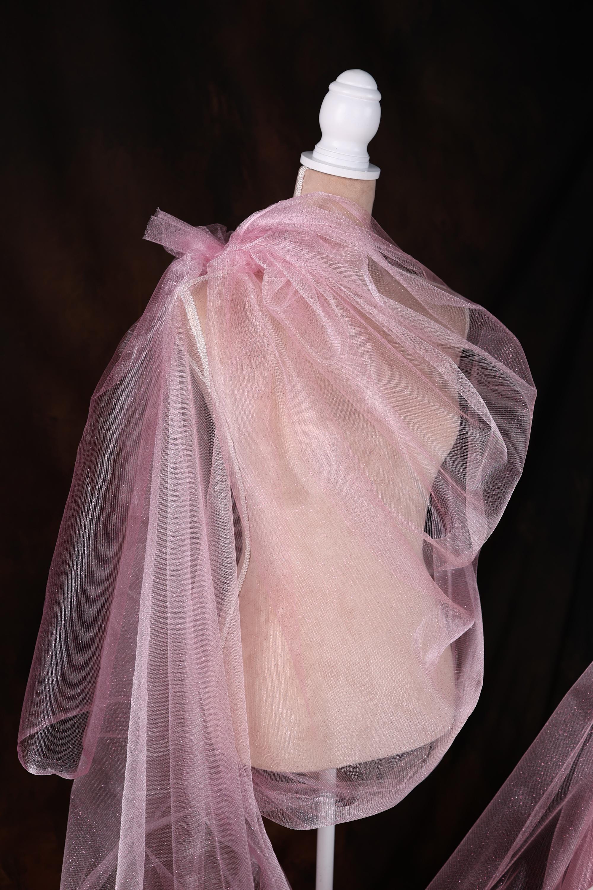 a mannequin wearing a pink tulle skirt