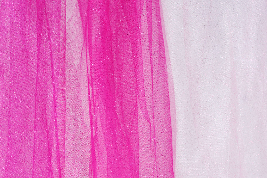 The image is a close-up of a fabric with a pink and white color scheme. The fabric appears to be a sheer material, with the pink fabric being more prominent and the white fabric partially visible on the right side.