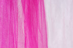 The image is a close-up of a fabric with a pink and white color scheme. The fabric appears to be a sheer material, with the pink fabric being more prominent and the white fabric partially visible on the right side.
