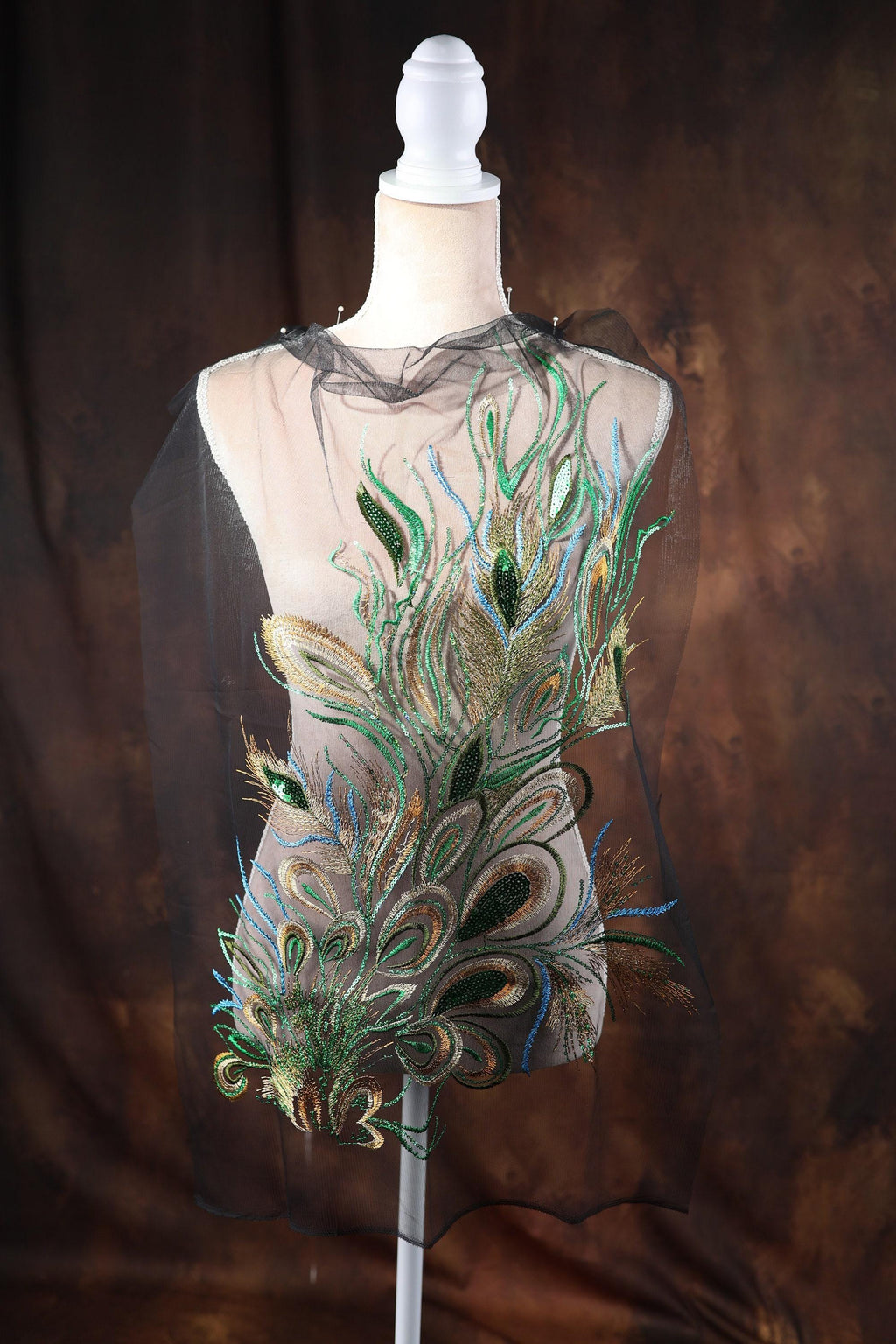 a mannequin with a dress made of feathers