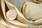 a close-up of a beige fabric with a wooden label that reads "Sewing Artisan Easy Shop" and "Taupe 118".