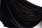 a black fabric with a shiny, glittery texture.