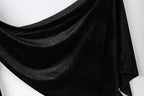 a black fabric with a shiny, glittery texture.