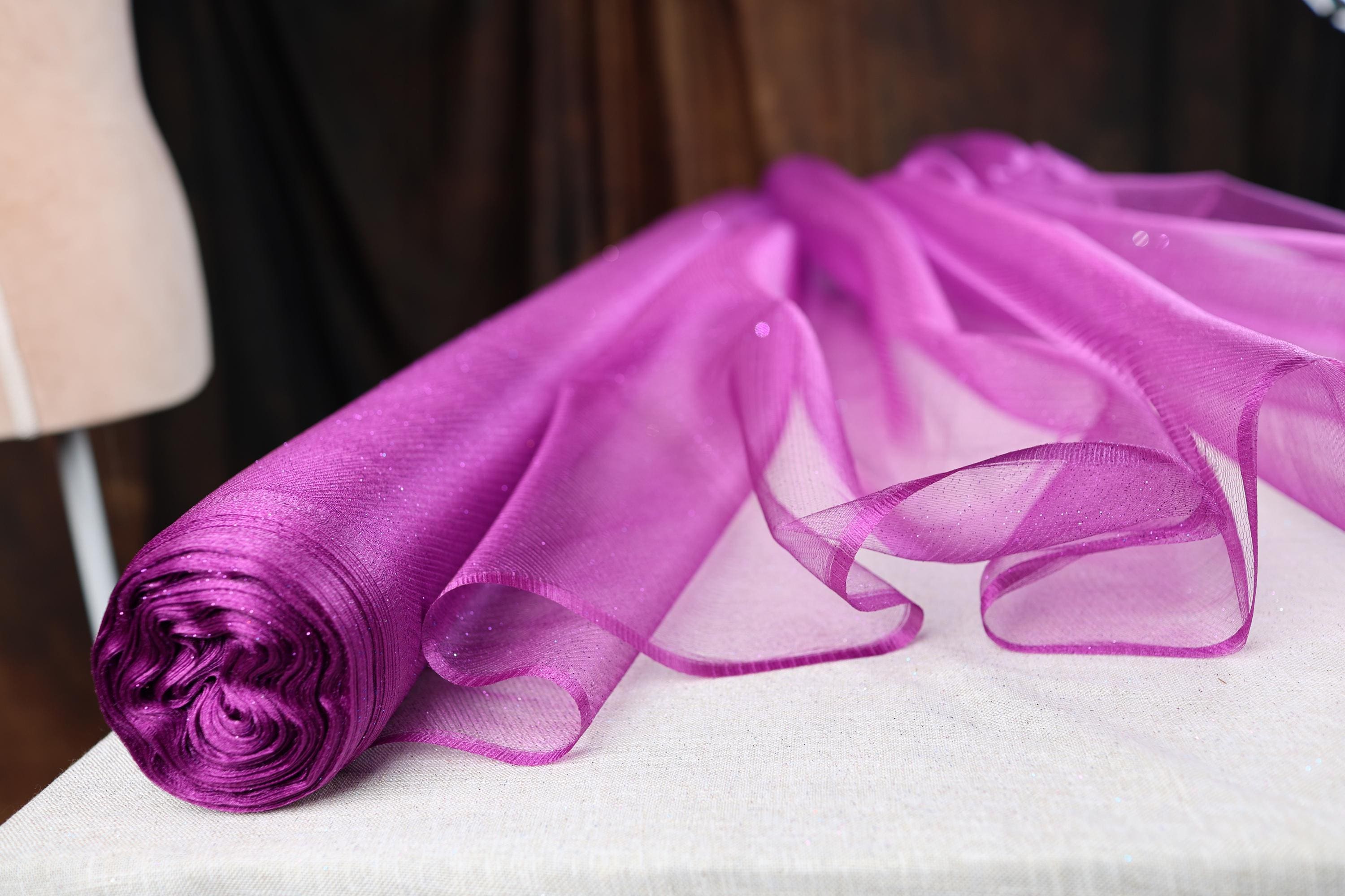 a close up of a purple cloth on a table